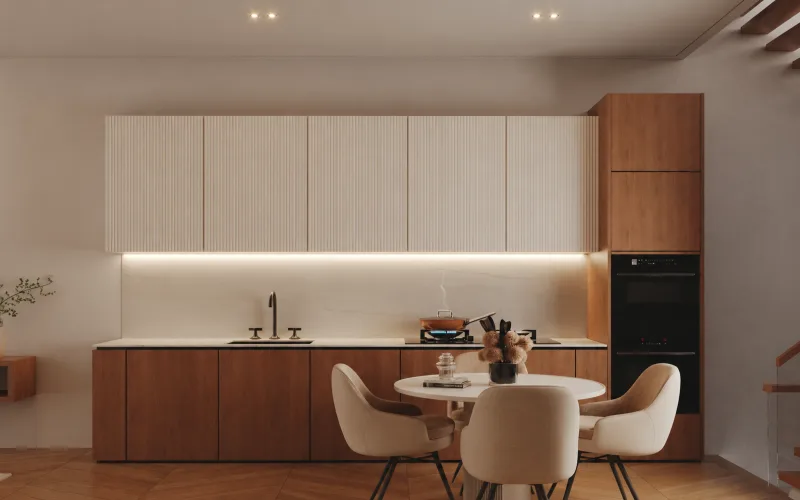 Modern kitchen with timber and white cabinetry and a round dining table