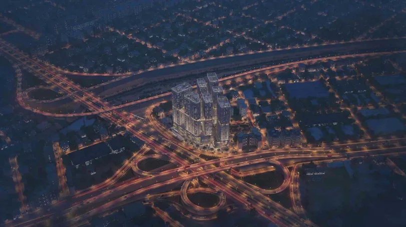 Aerial night visualization of residential towers among highway interchanges